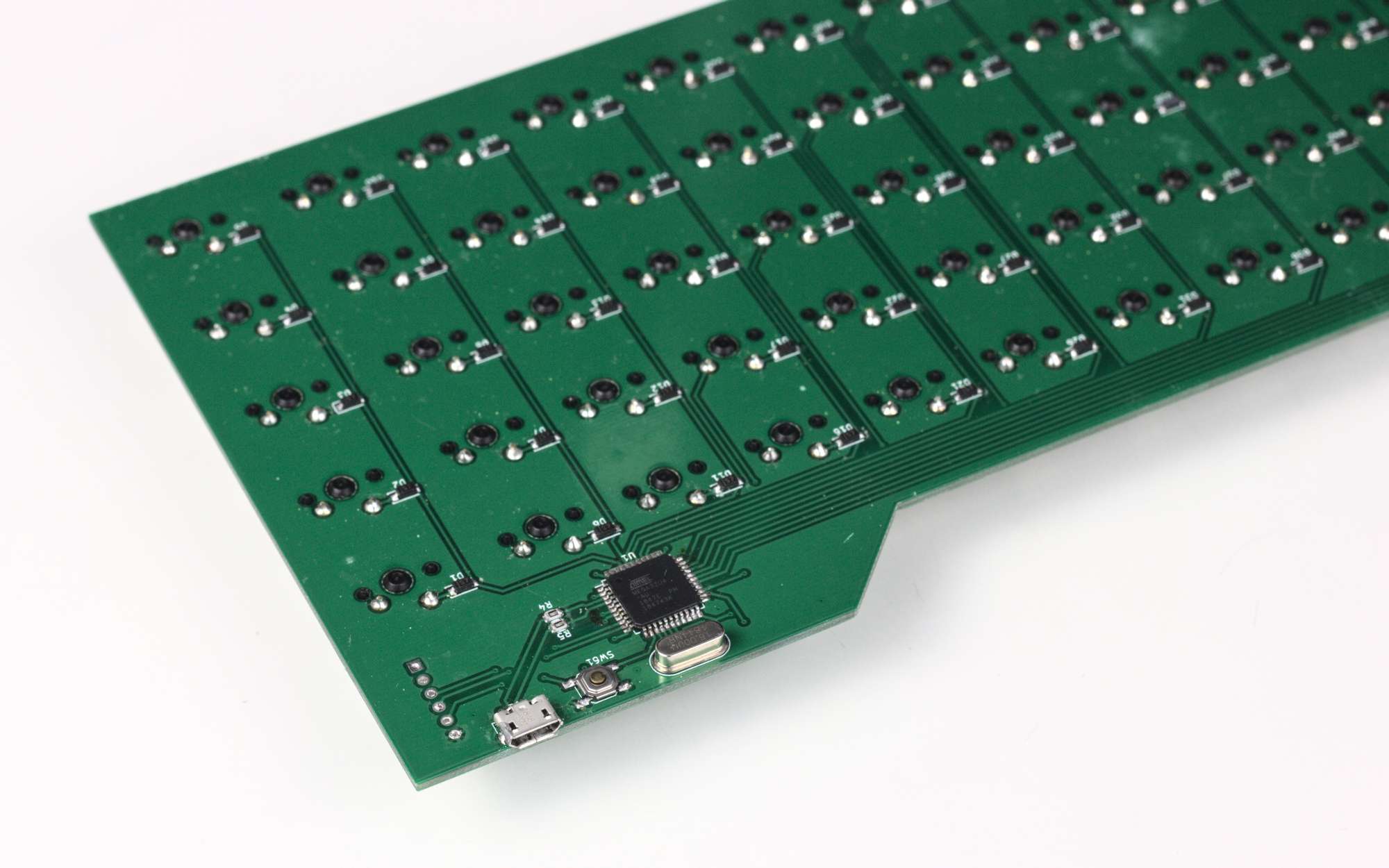 The corner of a keyboard PCB, showing the microcontroller